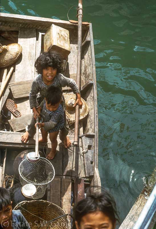 Chinese kids aboard a sampan, Aberdeen, HK