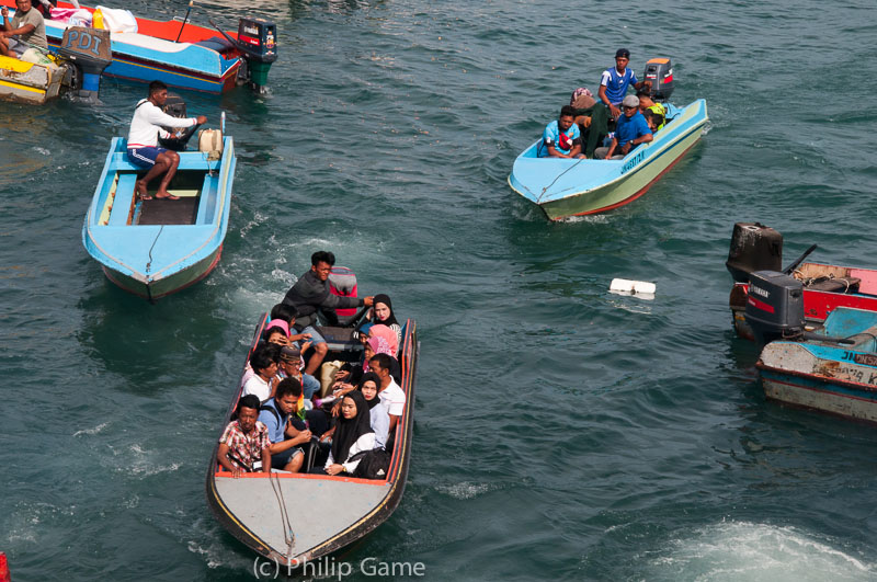 Morning commuters from Pulau Gaya (Gaya Island) reach Kota Kinabalu