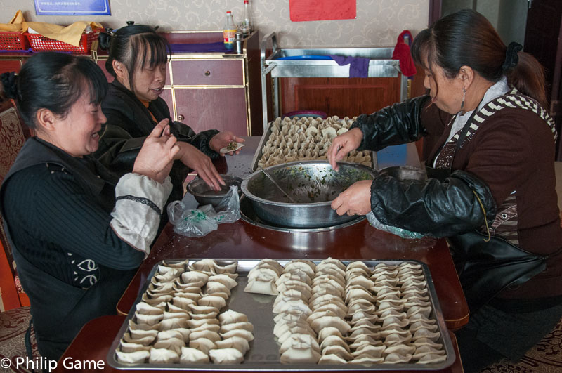 Hotel staff prepare dumplings