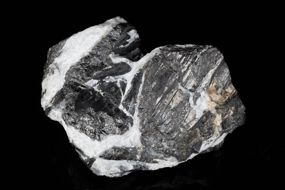 Wolframite blades to 5 cm in 9 cm quartz matrix. Carrock Mine, Caldbeck Fells, Cumbria, UK.