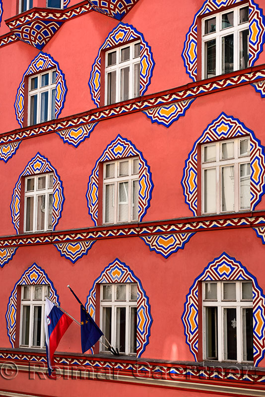 Brightly colored facade Vurnik House or Cooperative Business Bank Building by Ivan Vurnik 1921 painted by wife Helena in Ljublja