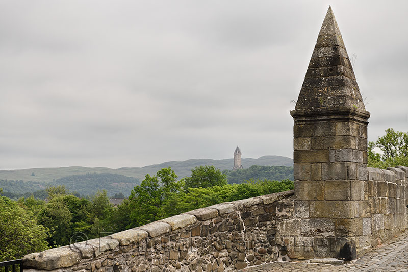 National Wallace Monument crown spire from the Old Stirling Bridge with clouds Stirling Scotland UK