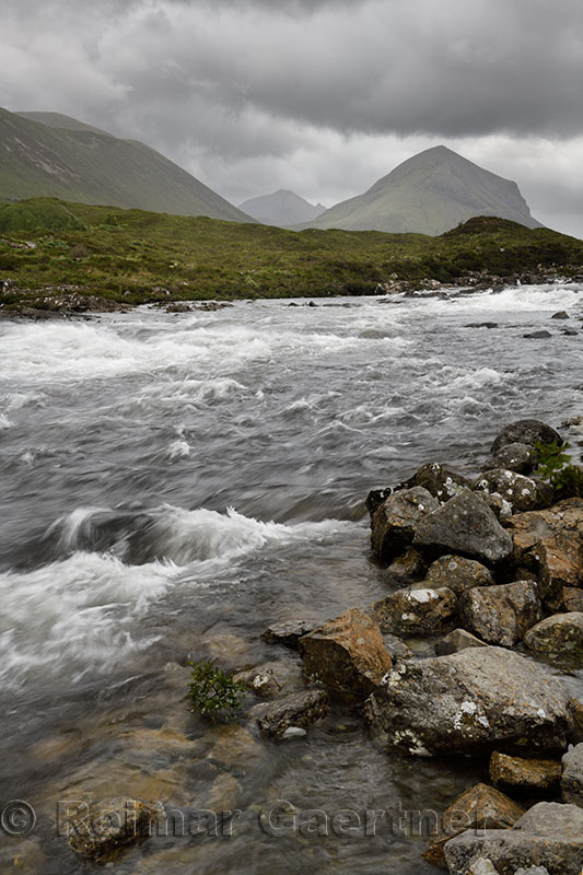 River Sligachan rapids after a storm with Marsco peak of Red Cuillin mountains Isle of Skye Scottish Highlands Scotland UK