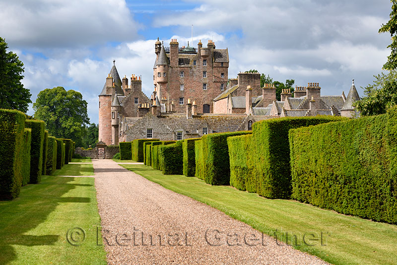 Red stone path with yew hedges in east Italian Garden of Glamis Castle home of Earl and Countess of Strathmore and Kinghorne Sco
