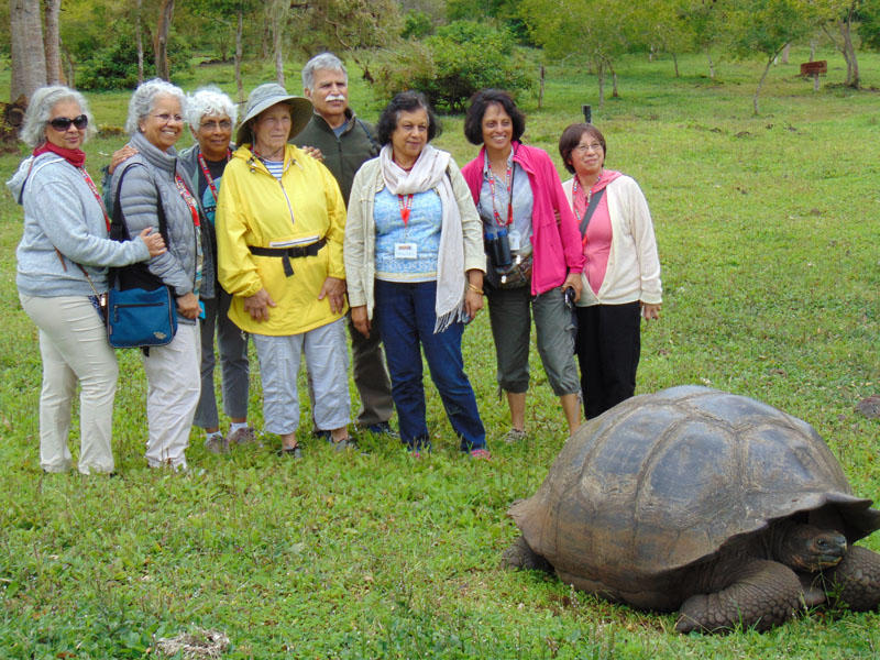Posing with a Giant Galapagos Tortoise