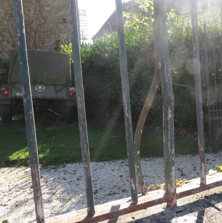 Fence with bullet dents