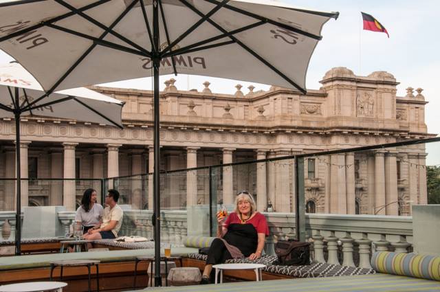 Roof top bar, Imperial Hotel with Victorian Parliament behind.
