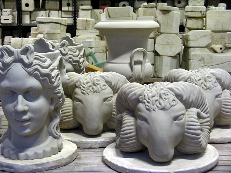 Molds fill shelves behind these Figures9263