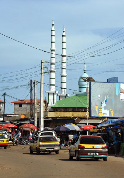 Yellow taxis and a mosque, Conakry