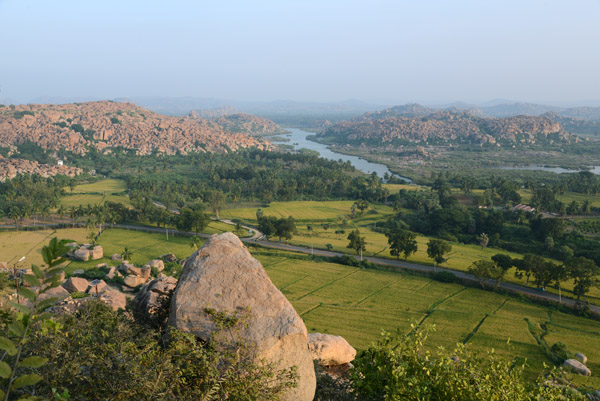 Rice paddies, the river and the rocky landscape of Hampi