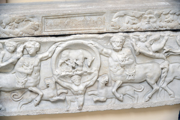 Child's sarcophagus with Centaurs and Atlas holding a clips with the female wolf, 2nd C. AD