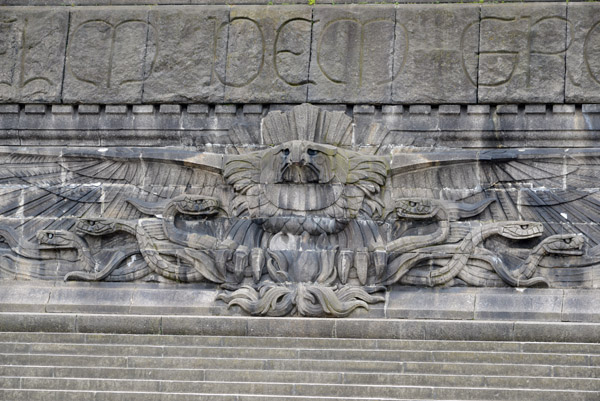 Relief at the base of the monument of the Reichsadler carrying off 6 snakes
