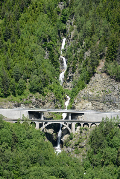 Waterfall from Piz Alpetta with road and rail bridge