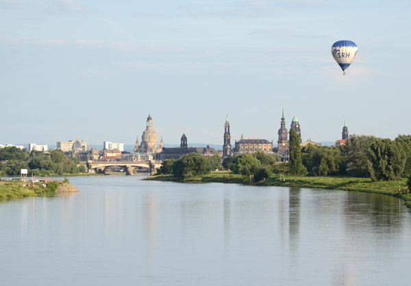 Balloon floating over the old city of Dresden on a still summer evening