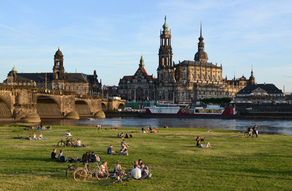 Cyclists among those relaxing and enjoying a pleasant summer evening along the Elbe, Dresden