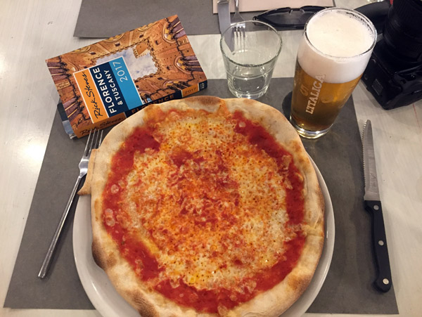 Margherita pizza with a beer with the Rick Steves guide to Tuscany