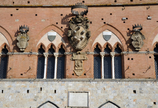 The Medici coat-of-arms on the Palazzo Pubblico