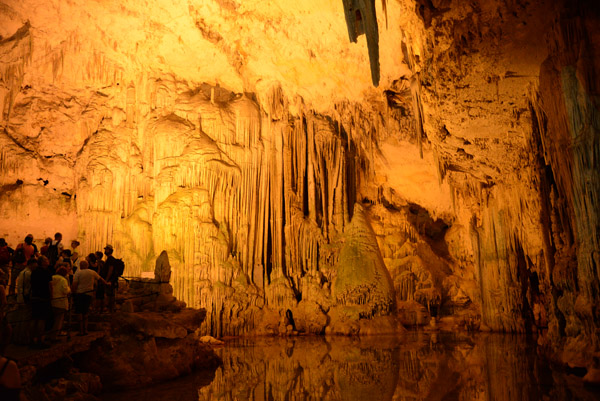 A tour group admiring the cave formations of Neptune's Grotto
