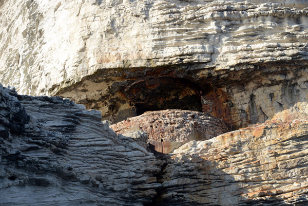 A tunnel cut through the rock leads down to Le Gouvernail