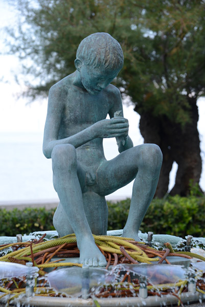 Sculpture of a boy fisher, Piazza della Vittoria, Marciano Marina