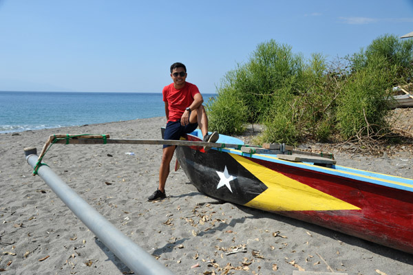A fishing canoe painted with the flag of Timor-Leste
