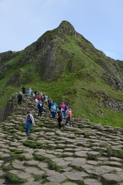 Tourists climbing on the Giant's Causeway