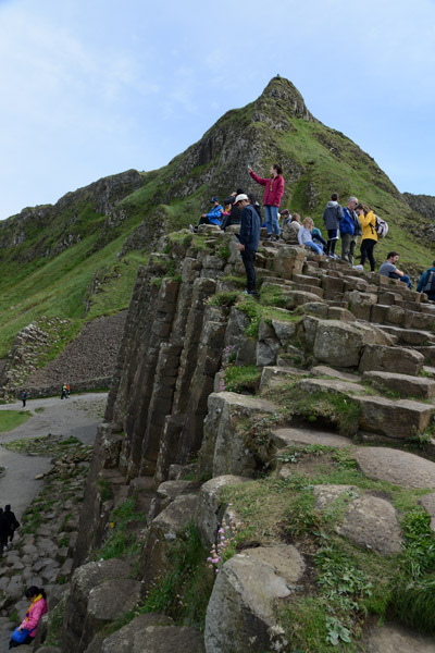 Tourists climbing on the Giant's Causeway