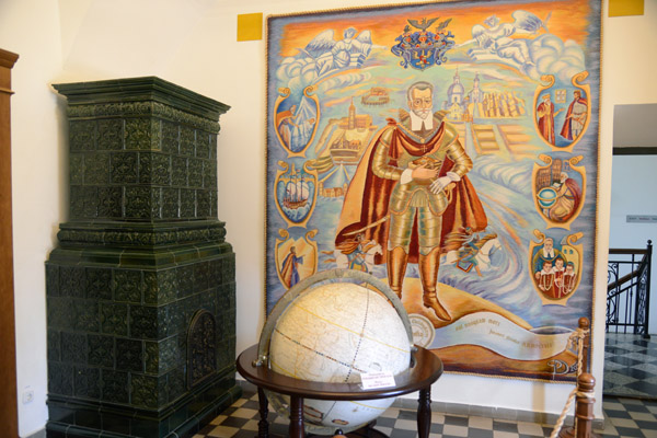 Interior of Nesvizh Castle with a modern tapestry of Prince Christoph Radzlwiłł with Roman numeral date 1568