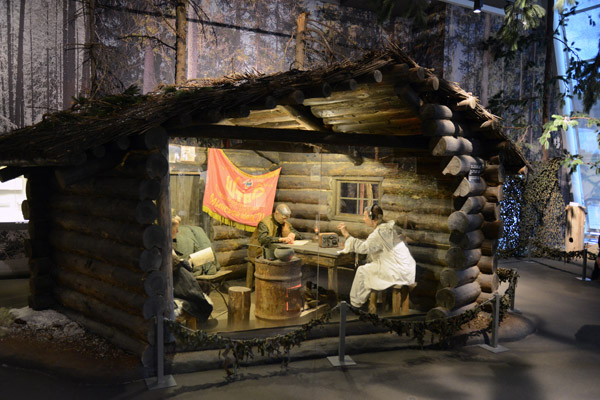 Reconstruction of a partisan cabin in a Belarusian forest during the Great Patriotic War
