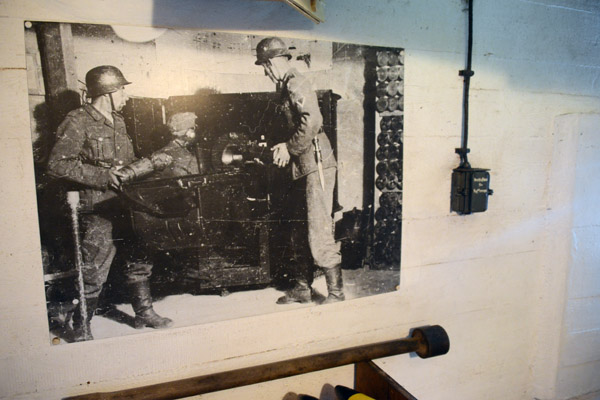 Vintage photo of German soldiers loading a coastal defense gun