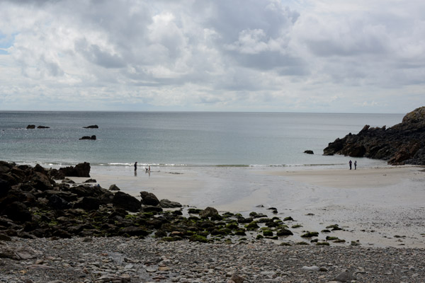 Le Petit Bt Tower protests the small beach at Petit Bt Bay