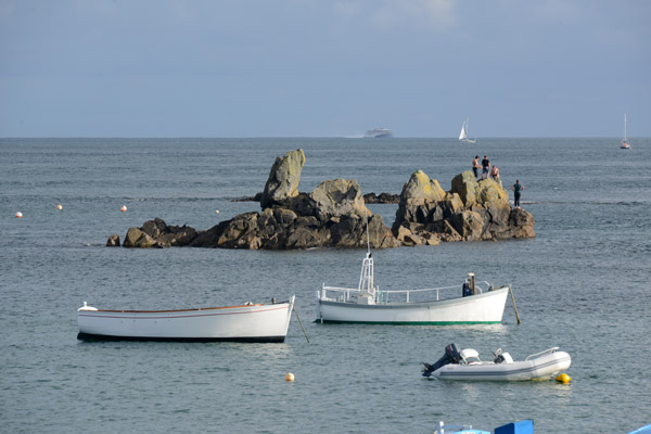 Small boats and rocks off Cocagne, Vale Parish, Guernsey