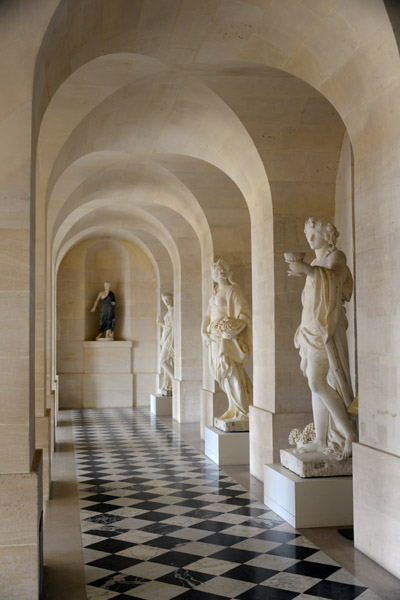 Sculpture lined hallway in the North Wing off the Cour Royale