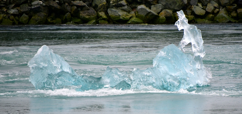Man on canoe iceberg, Jokulsa river, Iceland 854a 