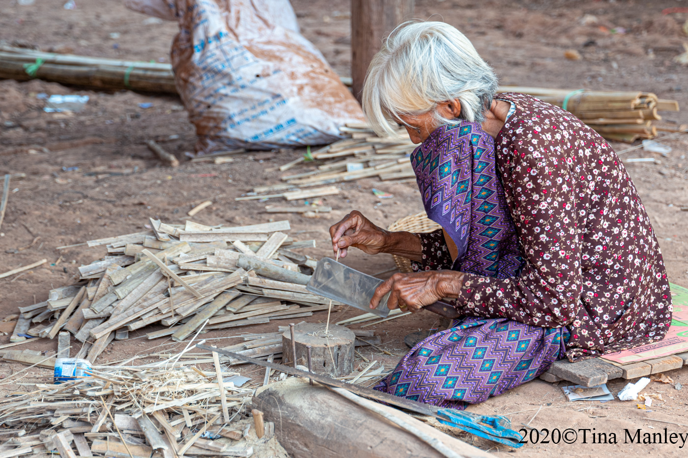 Mai Cutting Bamboo for Drying Fish