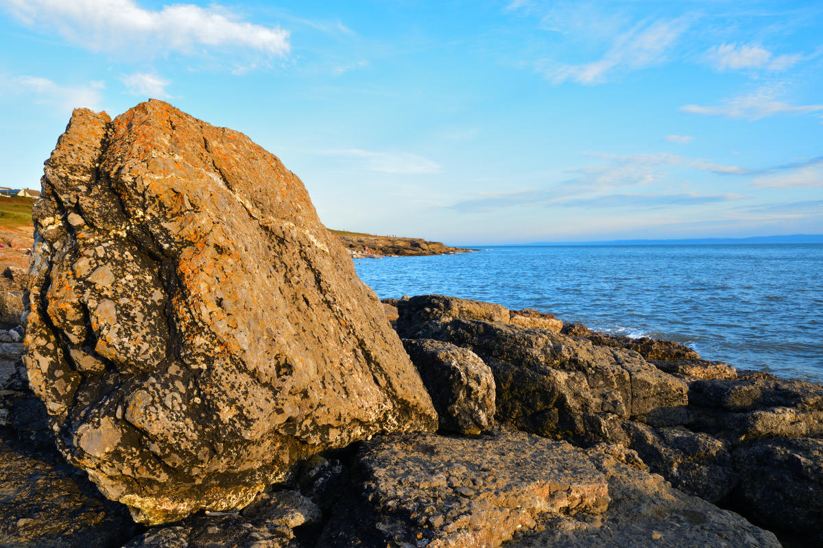 Triassic conglomerate limestone slab upending by the power of the sea.