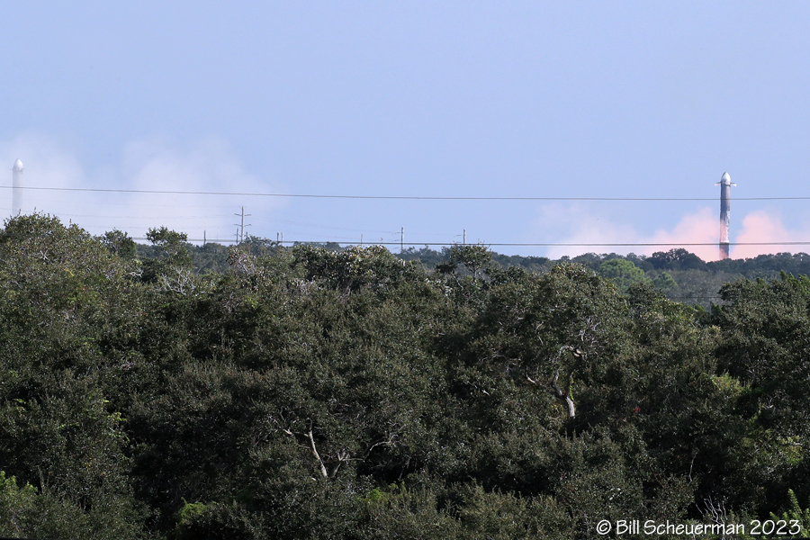 Space X booster on left landed booster on right just before touchdown.