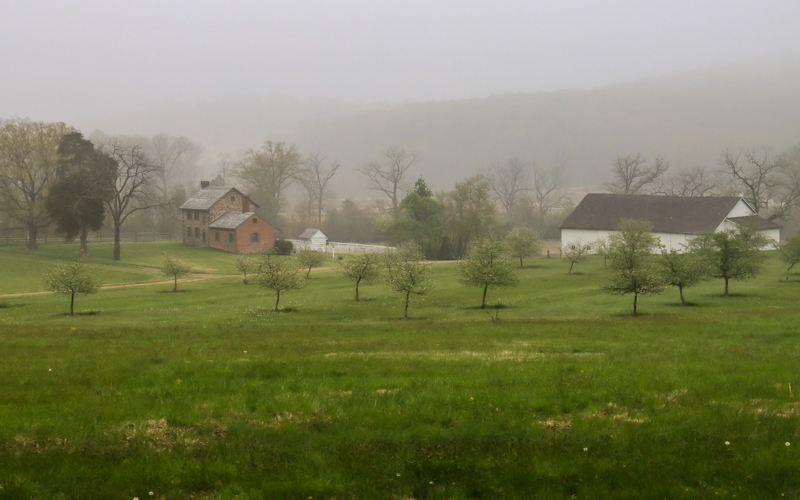 Fog shrouds a farmhouse on the battlefield in Gettysburg NMP