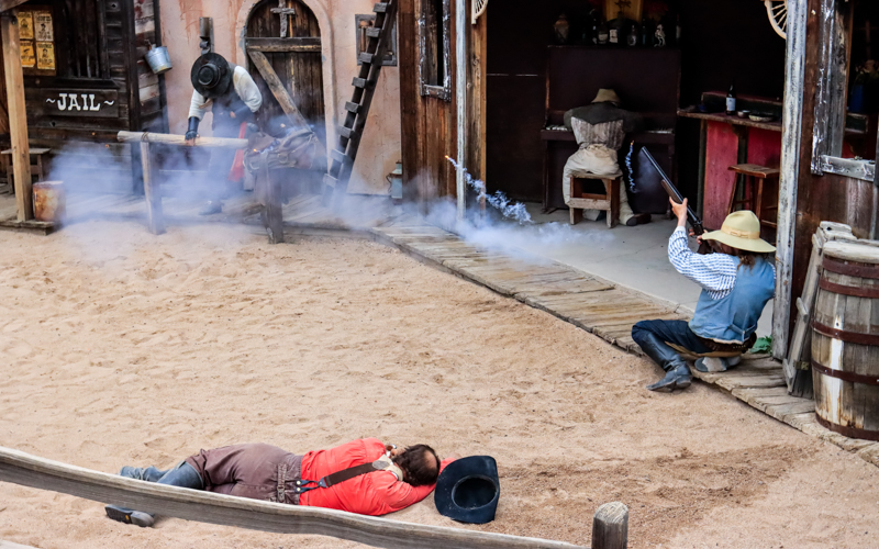 Sherriff fires a shotgun on the streets of Tombstone AZ