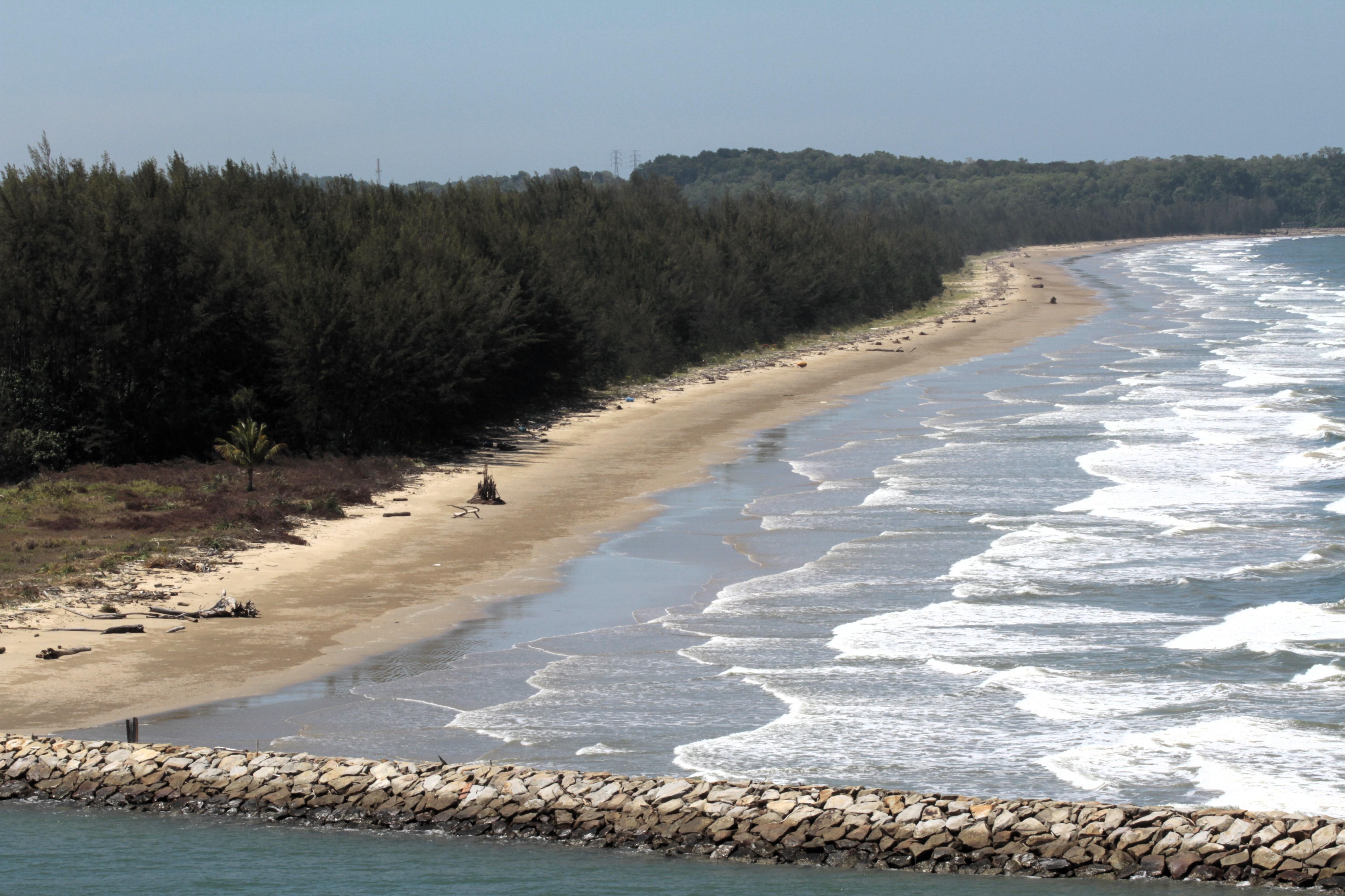We sailed by pretty but deserted Muara Beach near the port. Covering up well at the beach is required.