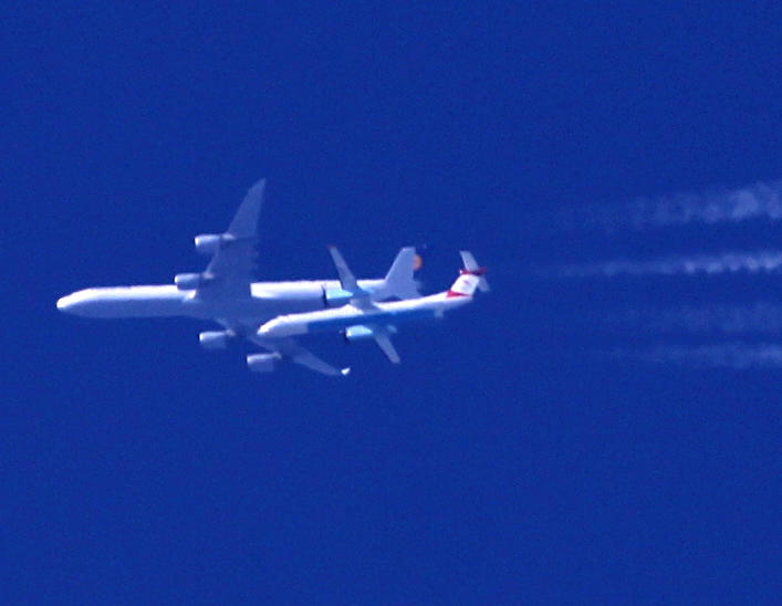 Lufthansa A340-300 going to the US and an Austrian DHC8-Q400 going to Birmingham UK (Brussels Airlines Titles) ..