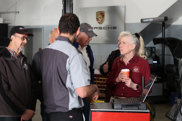 Porsche of Silver Spring technician demonstrates Porsches computerized diagnostic system. (2710)