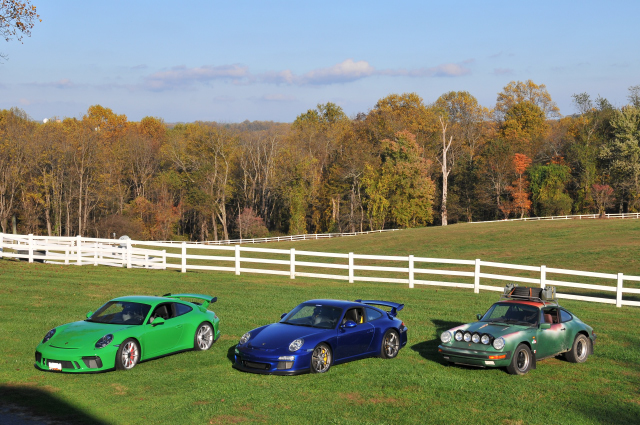 From left, 2018 Porsche 911 GT3, 2010 911 GT3, 1985 Safari 911 Carrera at Skip Conreys Valhalla Farm (8649)