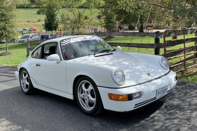 The winning duo Manny A and Bob G bide their time in Mannys 1990 Carrera. (0082)