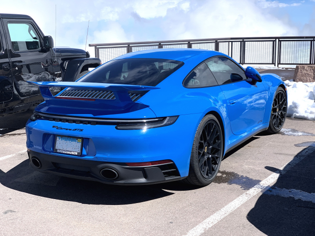 From Illinois, a 2023 Porsche 911 Carrera GTS (992), in Shark Blue with optional wing, at the summit of Pikes Peak. (9120)