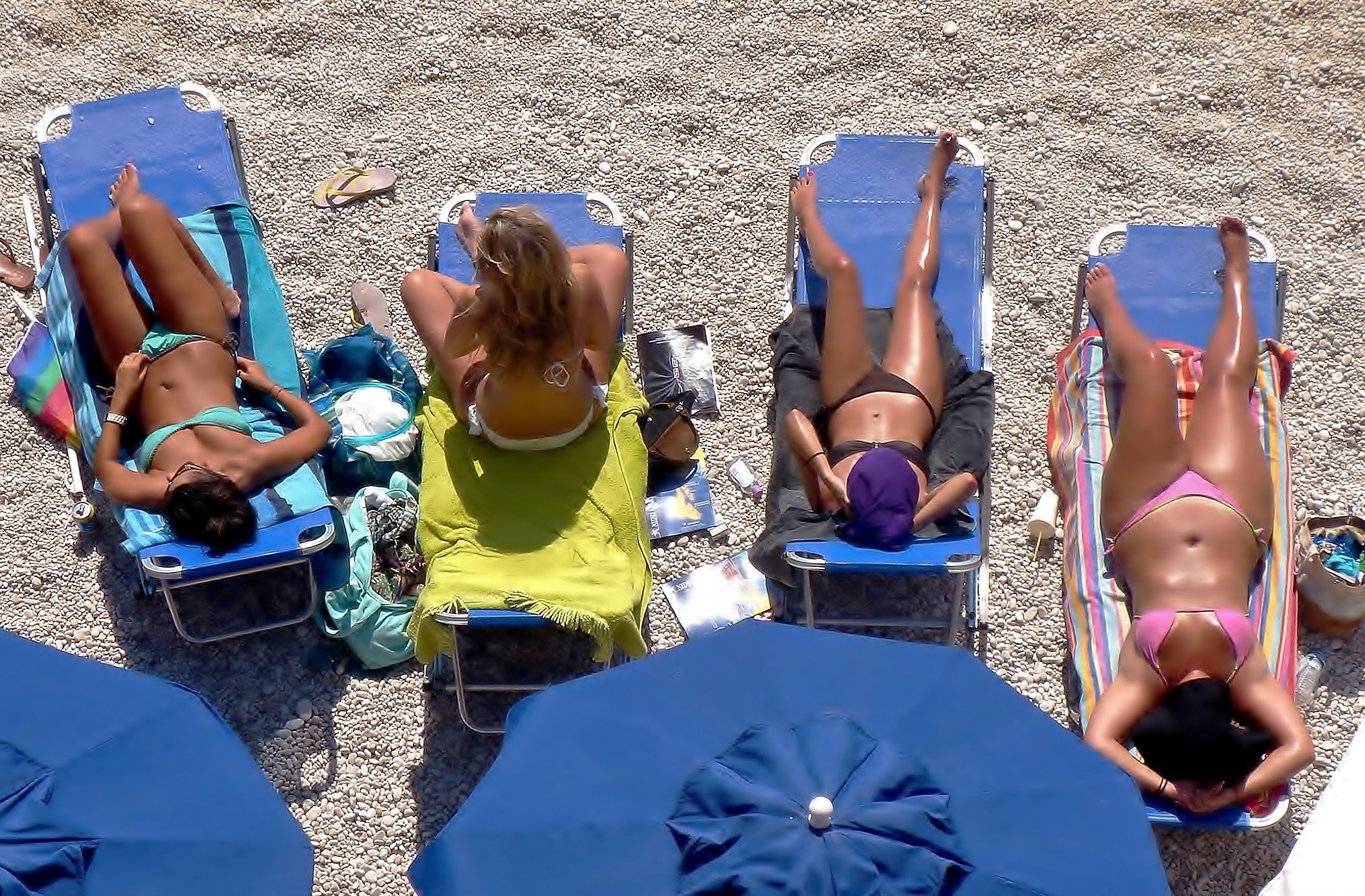 On the sand, under the sun.