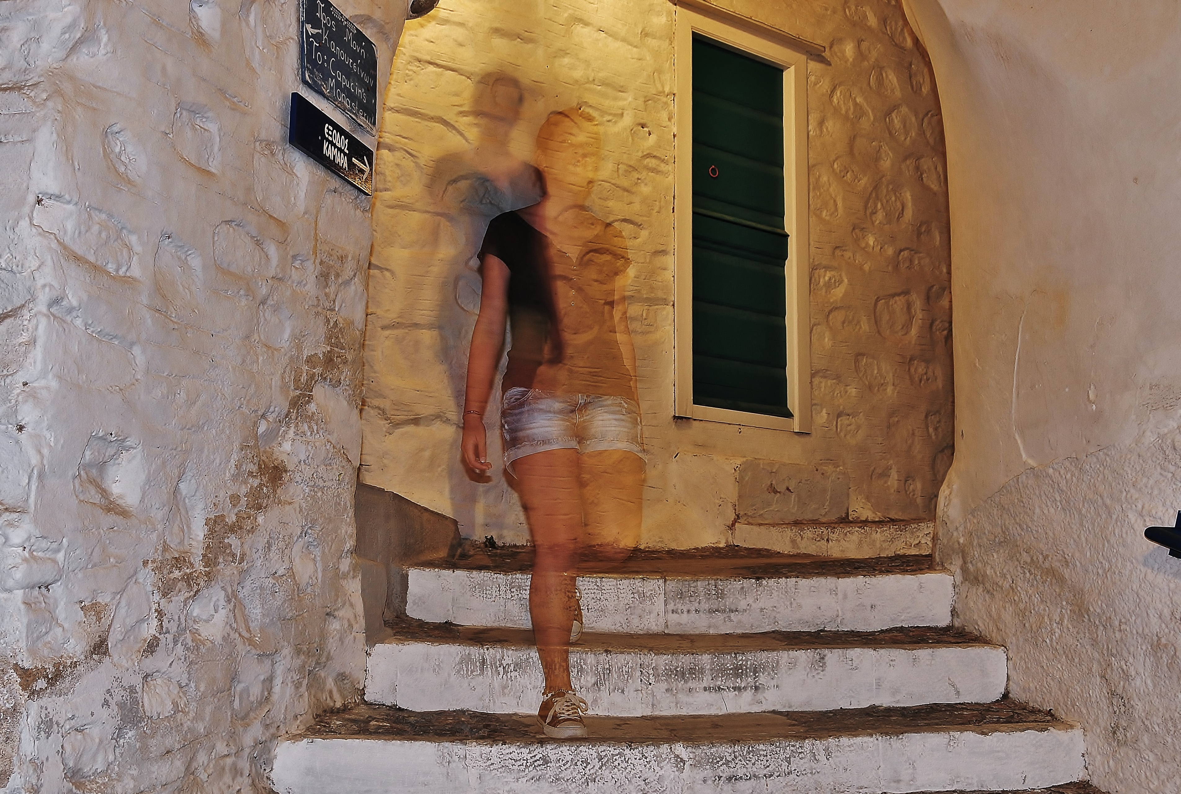 Walking at nightfall in the alleys of Ano Syros.