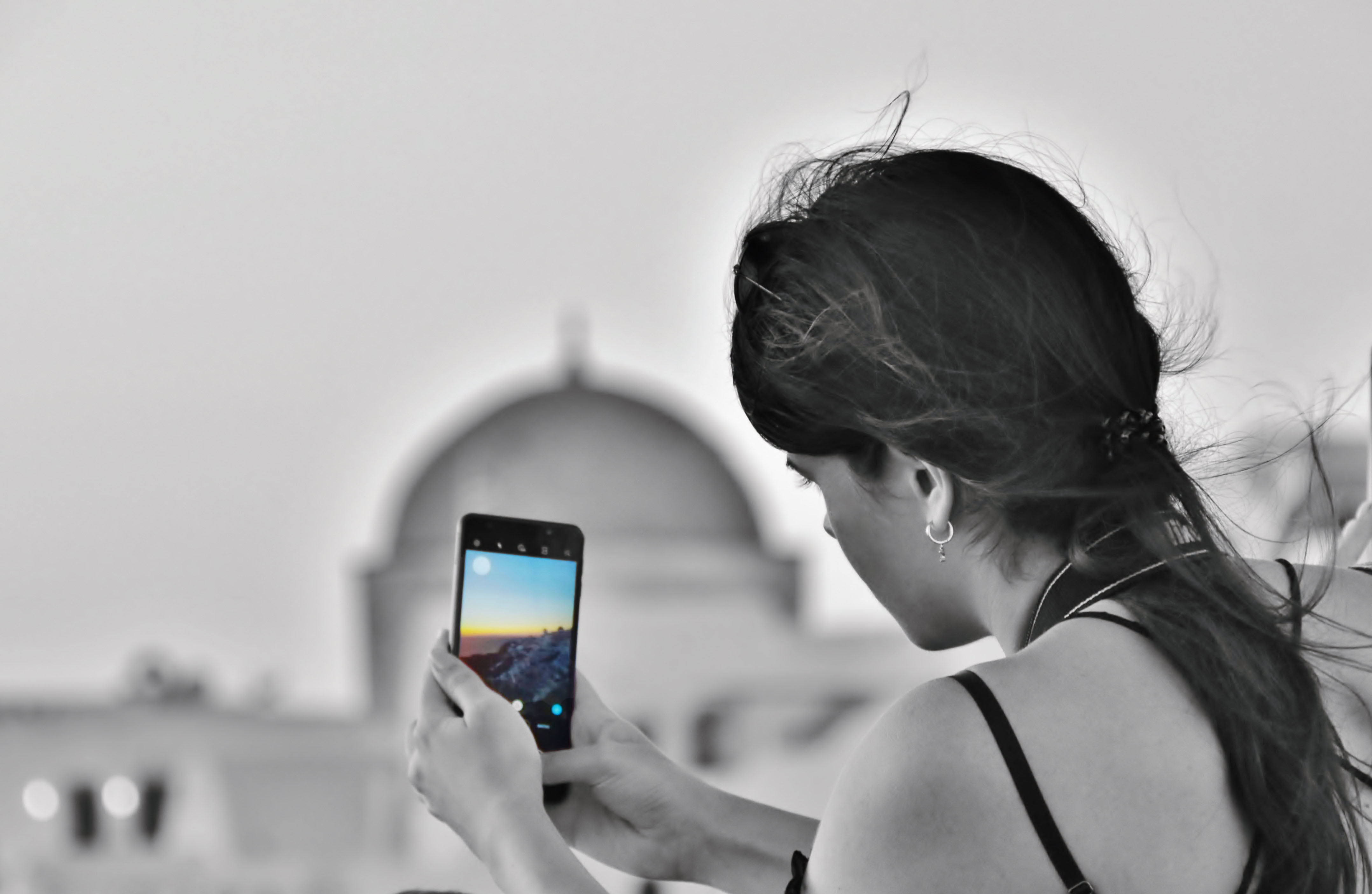 Danai having a sunset photo at Oia, Santorini.