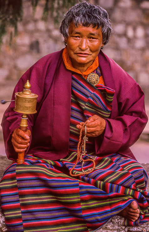 Woman with Buddhist Rosary and Prayer Wheel