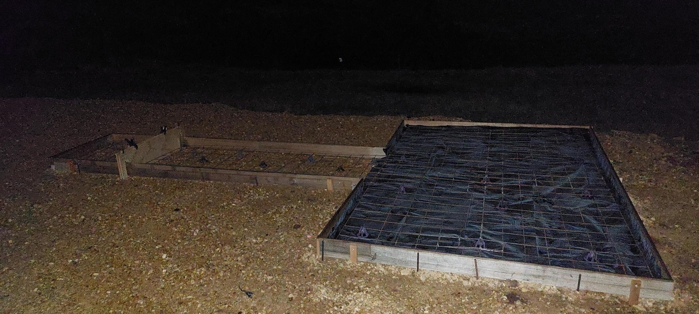 Plastic under slab and path-telescope isolation joint fabricated